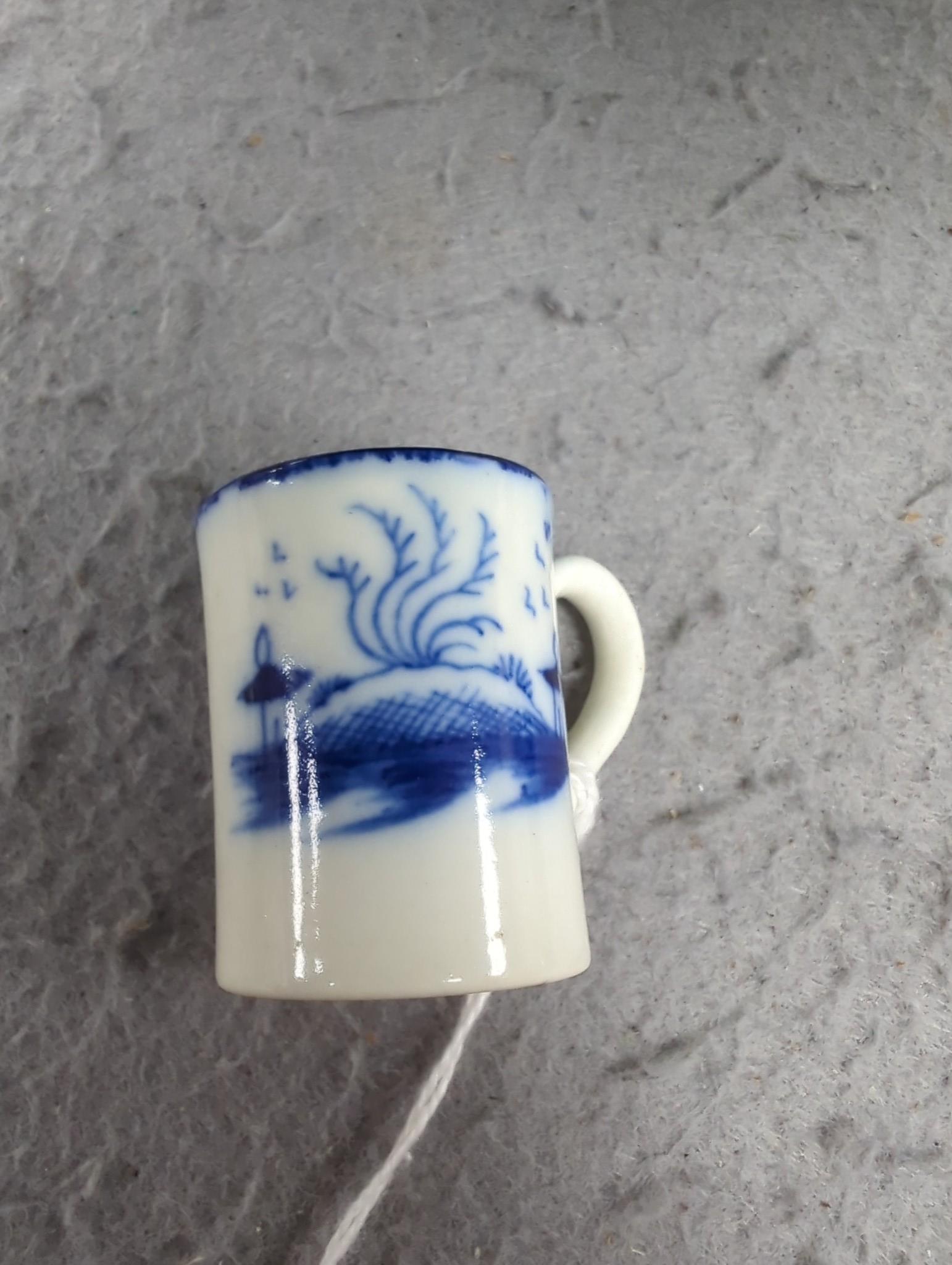 A late 18th century pearlware blue and white miniature jug, 5cm, and tea bowl and an English porcelain miniature mug, late 18th century